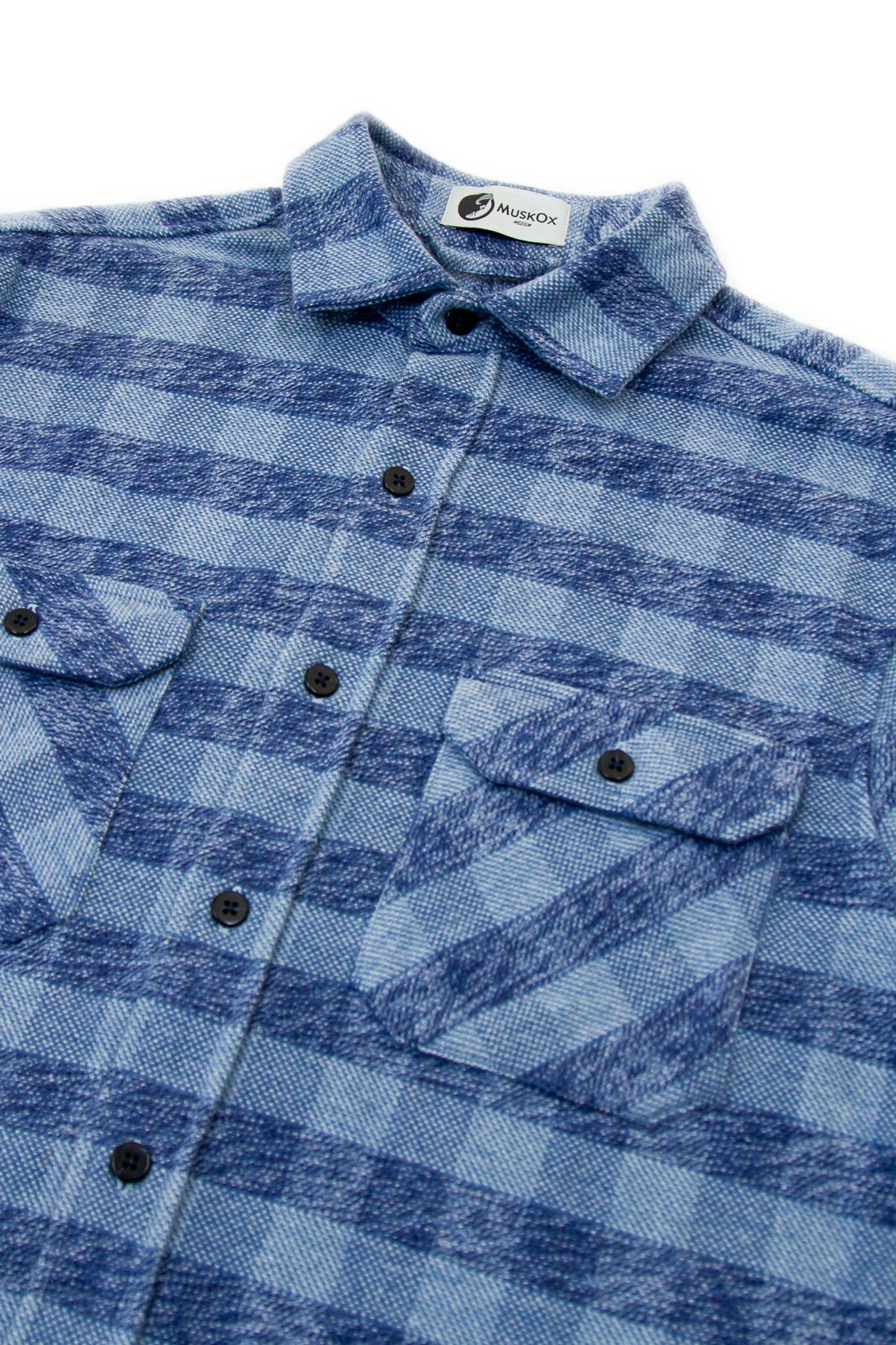 Blue plaid shirt with a brand label on a white background