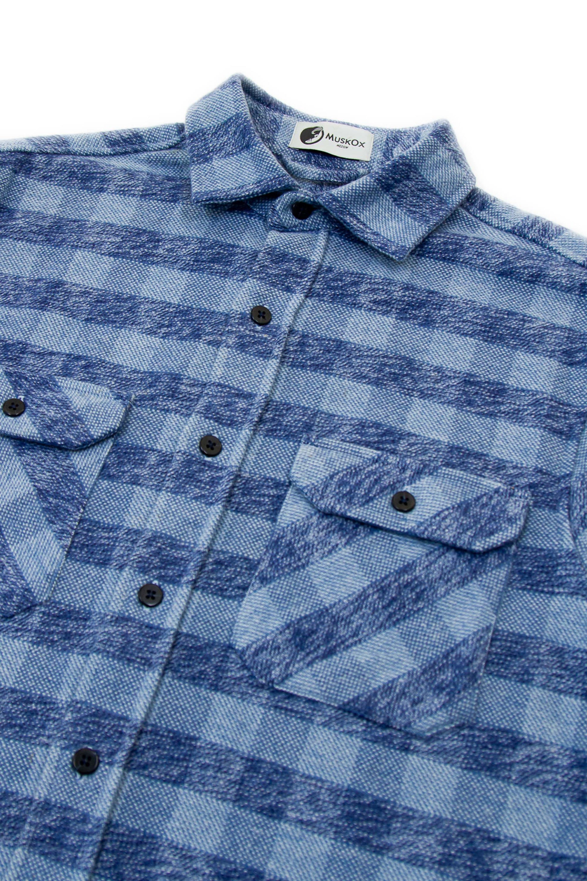 Blue plaid shirt with a brand label on a white background